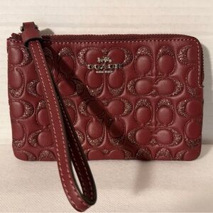 Coach Burgundy Glitter Signature Embossed leather wristlet